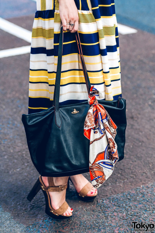 Tokyo-based lingerie model Miu Tran on the street in Harajuku wearing a One Spo lace top, striped mi