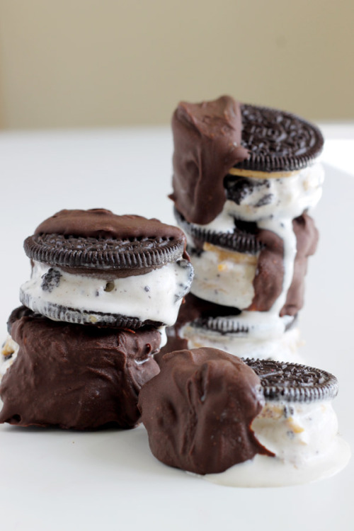do-not-touch-my-food:  Chocolate Dipped Oreo Ice Cream Sandwich  This
