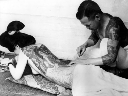 thatgirlisarollingstone: An unidentified Japanese tattoo artist works on a woman’s backside, ca. 19