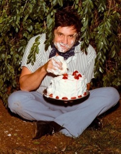 pisslick:Johnny Cash eats strawberry cake in a bush, 1971. Part of a photo shoot. He was probably not high. Relatable.