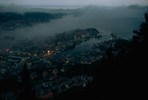 natgeofound: Embracing the fjord, a dusk-dimmed Bergen laps against mountain walls, Norway, 1971Phot