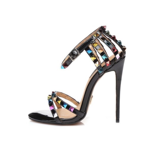 Multi colored studs on black strappy sandals, so hot! Head over to www.archenemys.com where our line