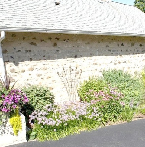 Rustic LandscapeAn Example Of A Mid-sized Rustic Drought-tolerant And Full Sun Side Yard Brick Flower