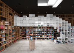 throughjo:  irregularly-sized shelves…  Book Centre Trieste shop by SoNo Arhitekti