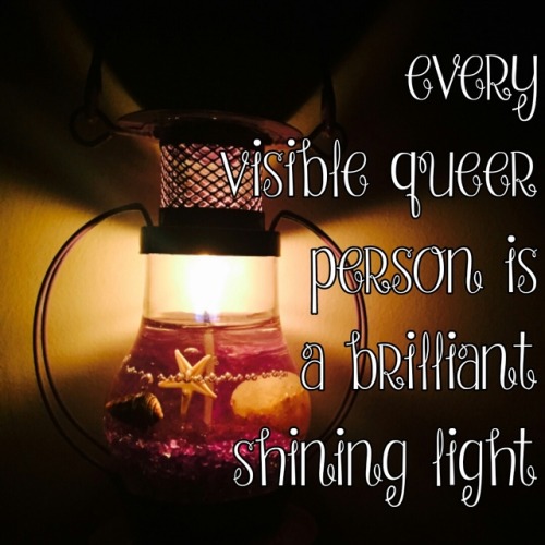 (Image description: a glowing lantern and white text that says &ldquo;every visible queer person is 
