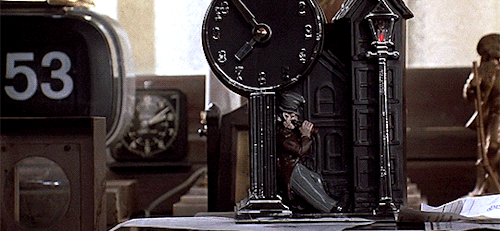 In the first film, sixty-three clocks can be seen, including one digital, and one that shows Harold 