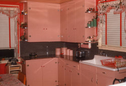 geewhiz:  A kitchen that’s pink down to the paper towels. From electrospark, 1956. 