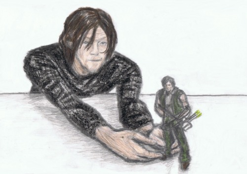 Norman holding Daryl figure