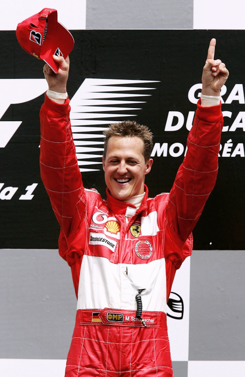 CANADA, 2004 — Michael Schumacher, 1st position, celebrates on the podium. (Photo by Mark Thom