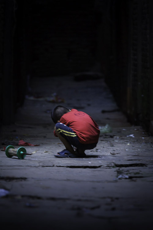 Broken Kite by Simeon Patarozliev Via Flickr: A Nepali kid in the streets of Kathmandu. I remember t