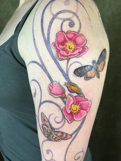 Spiral weaves with wild roses and moths.Tattoo by Daemon Rowanchilde, May 2015.www.urbanprimitive.co