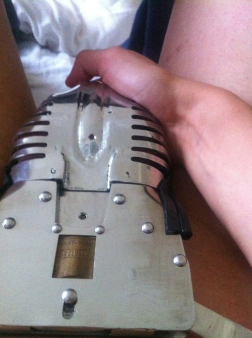 strappedown:  Having had my cock locked up like this on occasion, I can tell you that holding it this way, feeling the warmth through the metal, is the only sensation you can get. Nothing you do penetrates the steel shell and tube to provide any relief.