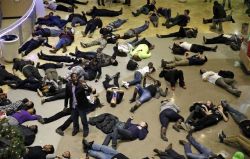 the-gasoline-station:  Ferguson Protesters Stage ‘Die-In’ at Missouri Mall In an attempt to disrupt “Black Friday” shopping, protesters staged a “die in” Friday, lying down like corpses at a mall in Chesterfield, Missouri, in response to a