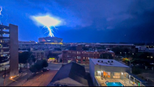 evilbuildingsblog:  Mercedes Benz Stadium during a lightning storm in downtown Atlanta last night