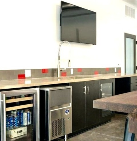 Single Wall Orange CountyLarge Industrial Single-wall Wet Bar Design With Flat-panel Cabinets, An Undermount