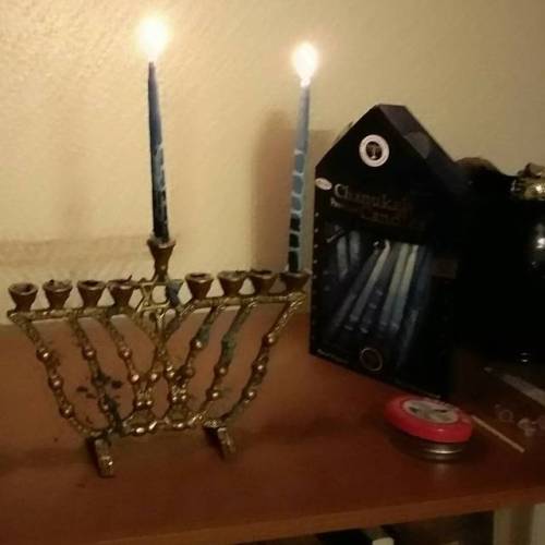 atalantapendrag:Boston has his Chanukah bowtie on to watch me light the candles for the first night.