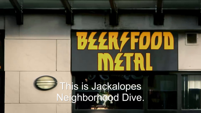 95% sure it's a sign on the side of a building. Caption: This is Jackalopes Neighborhood Dive.