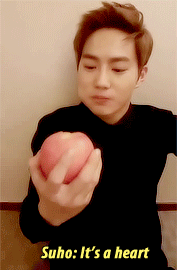 irpsychotic:  Suho almost chokes on an apple just to make a heart for EXO-L 