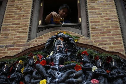 Abhiseka (ritual bath) of Nagaraja and naginis during Nagapanchami festival, Nepal, photos by Sunilk