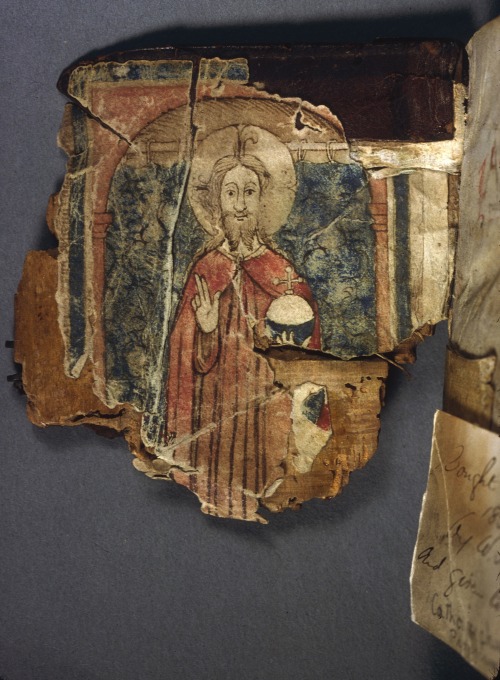 erikkwakkel:Big smileYou are looking at a heavily-damaged front cover of a medieval book. Only half 
