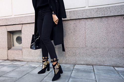 Kenza Zouiten in Classic Black.Pants, coat and Boots from Ivyrevel’s Bag from Balenciaga