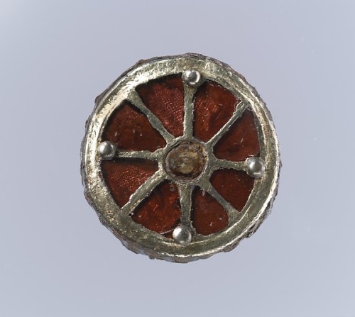 Frankish silver-gilt and garnet brooches, 6th centuryGarnets, worked in the cloisonné technique, fea