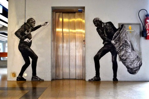 asylum-art-2:The infernal machine – The latest street art creations of french artist Levalet Here a