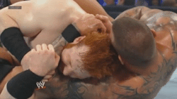 Randy is coiled around sheamus like the viper