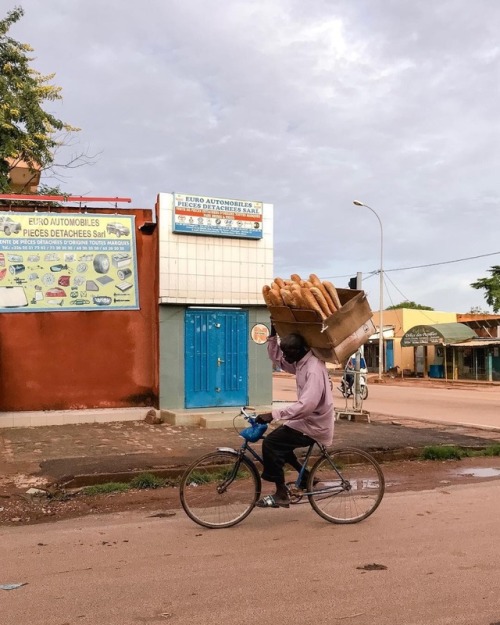 forafricans:A man delivers bread on a bicycle. Ouagadougou, Burkina Faso. ©Saida Augustine