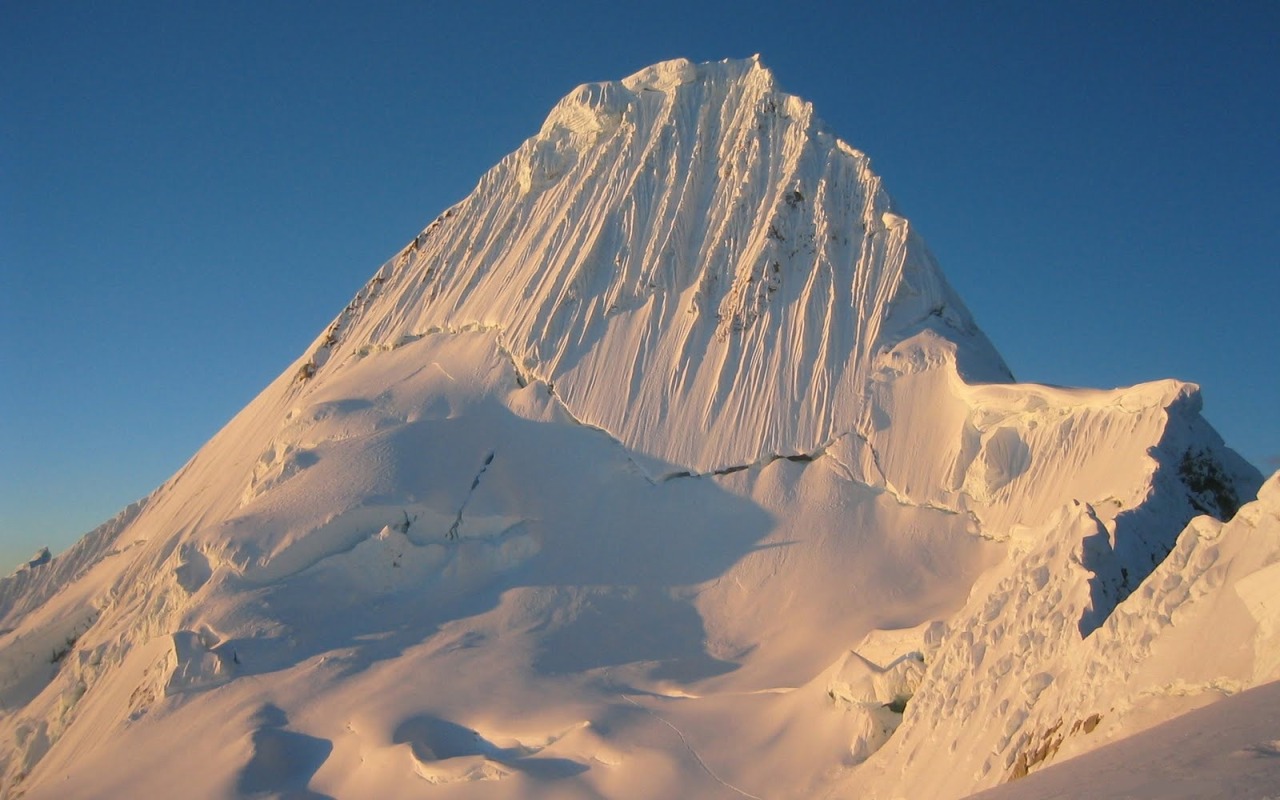 Alpamayo, a peak in the Cordillera Blanca in Peru; a steep (sixty degrees), almost