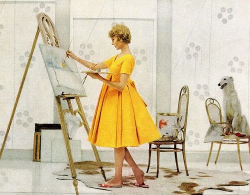 Model painting wearing dress by Arnold Scaasi, 1959. Photograph appeared in Mennen Baby Oil ad.In th