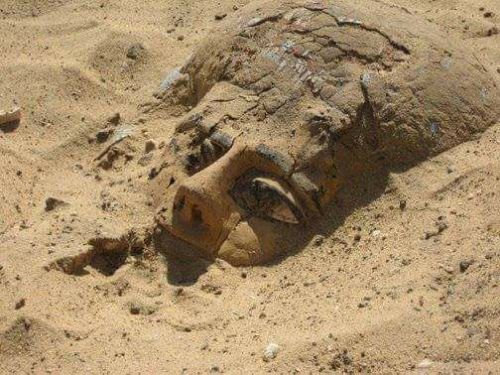 acheiropoietos:totenbuch:A wooden sarcophagus rises from the sand in Abydos after thousands of years in silence.me getti