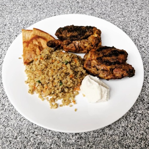 Tandoori seasoned grilled chicken thighs, califlower fried rice, Joseph&rsquo;s low carb pita, and a