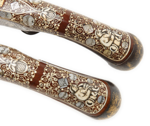 A pair of bone inlaid flintlock pistols originating from Silesia, 18th century.