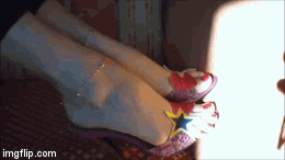 Goddess with perfect feet showing off her anklet and shoes.