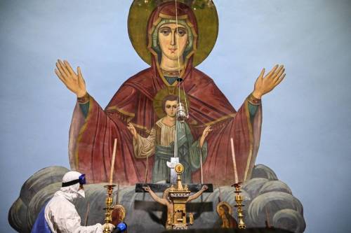 Workers with Istanbul’s Metropolitan Municipality disinfect the Panagia Altimermer Church in Istanbu