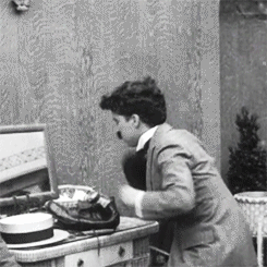 chaplinfortheages:  1919 - Charlie Chaplin shows the Bishop of Birmingham how he