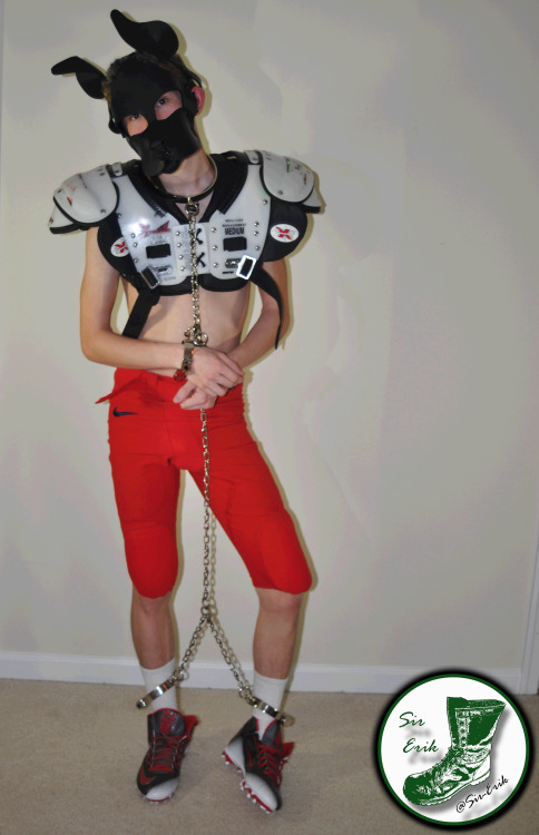 hyper-pup: This pup found some football  gear to play in! :P @sir-erik found me pupping about and had to restrain my hyper-activities with some steel cuffs 