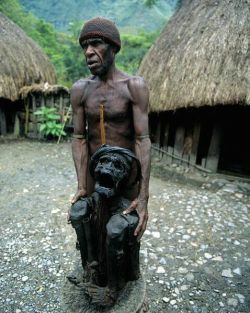 unexplained-events:  A Dani Tribesmen shows off his mummified grandfather(also the old chief of the tribe)