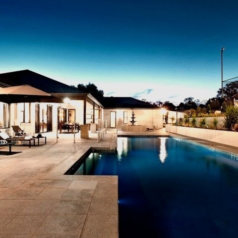 Concrete ExteriorLarge Transitional Beige One-story Concrete Exterior Home Photo With A Metal Roof