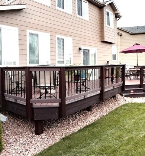 Uncovered - DeckDeck - Mid-sized Traditional Backyard Deck Idea With A Fire Pit And No Cover