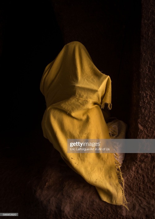 Ethiopian Christian Orthodox woman praying in a church, Lalibela (2016).