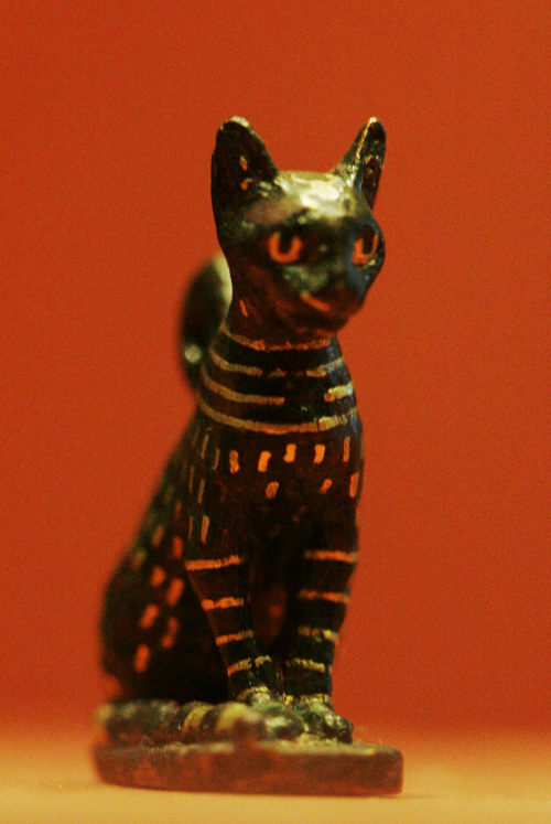 Ancient Egyptian cat amulet in bronze and gold, thought to represent the goddess Bast/Bastet.  Artis