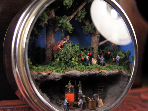 Here’s my latest miniature world, this time built inside in a vintage clock case. A man and a 