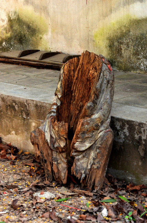 Remains of an old rotting statue on the grounds of Quan Thanh Temple, Hanoi, Vietnam.