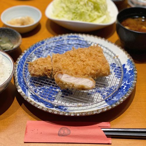 Tonkatsu Pork cutlet meal set with rice, soup, pickles, and shredded cabbage salad. Their pork comes