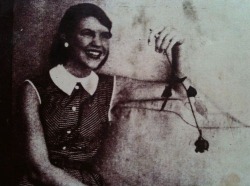 lovingsylvia:  Sylvia Plath in Mademoiselle magazine, August 1953 *** “Come on, give us a smile.”  I sat on the pink velvet loveseat in Jay Cee’s office, holding a paper rose and facing the magazine photographer. I was the last of the twelve to