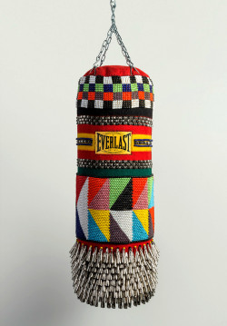 leonardhq:  Jeffrey Gibson (Cherokee/Choctaw),    American Girl, 2013,  Found punching bag, wool blanket, glass beads, steel studs, artificial sinew, tin jingles and chain, 43 x 16 x 16&quot;,  Leonard HQ 