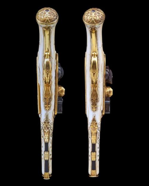 A pair of ivory stocked, gilt flintlock pistols made for King Louis XVI circa 1770.from Holt’s Aucti