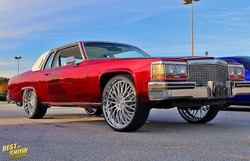 GDAWG803 — #WetpaintWednesday Kandy Red Caddy on @dubwheels...